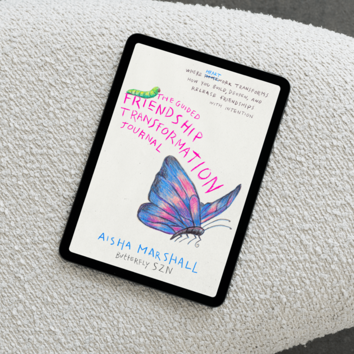 Digital version of a Book titled 'The Guided Transformation Journal' by Aisha Marshall on a textured surface