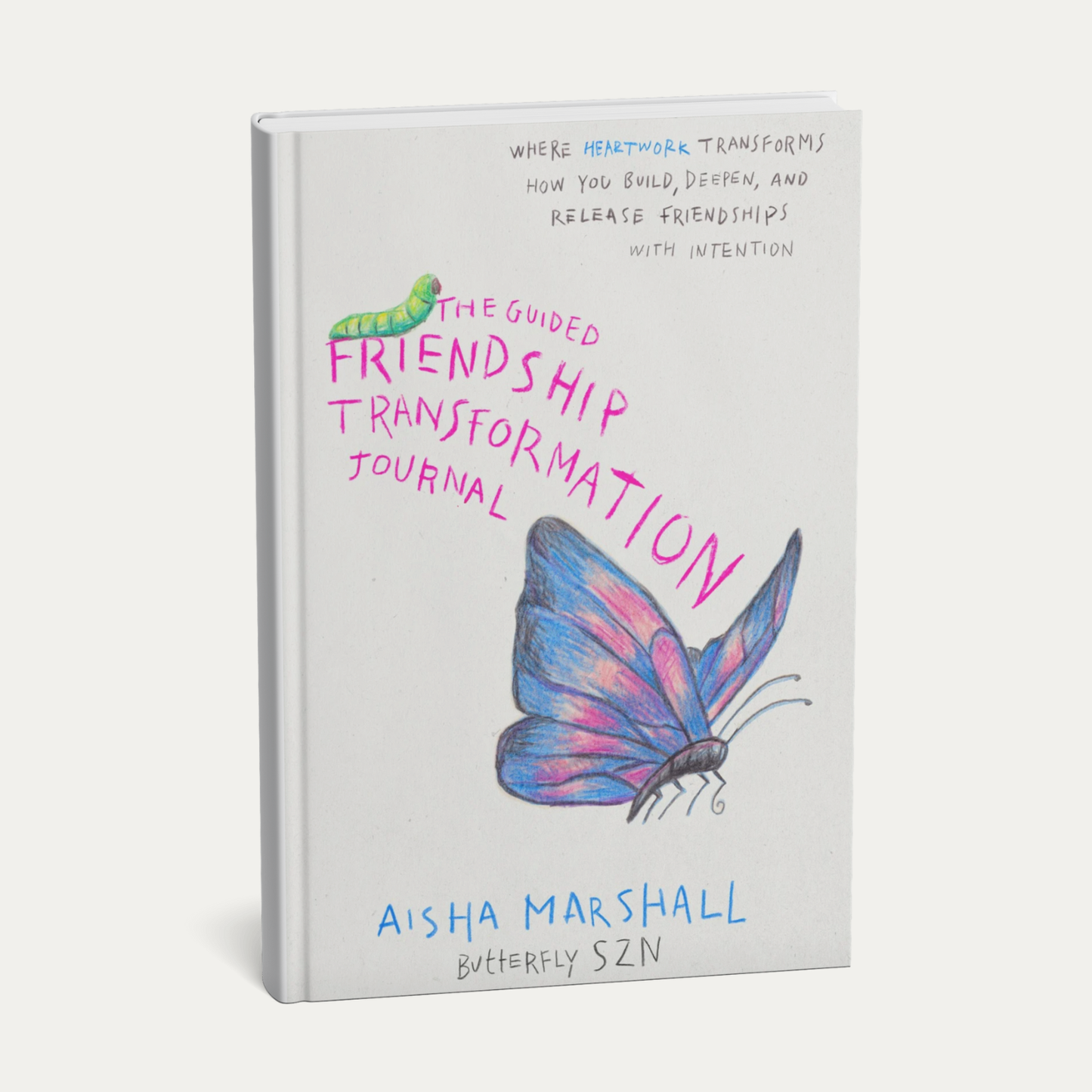 Book titled 'The Guided Friendship Transformation Journal' with a butterfly illustration on a white background